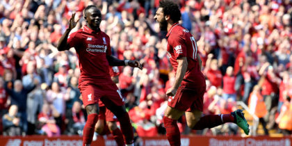 LIVERPOOL, ENGLAND - MAY 13: Mohamed Salah of Liverpool celebrates with Sadio Mane of Liverpool after scoring his sides first goal during the Premier League match between Liverpool and Brighton and Hove Albion at Anfield on May 13, 2018 in Liverpool, England. (Photo by Michael Regan/Getty Images)