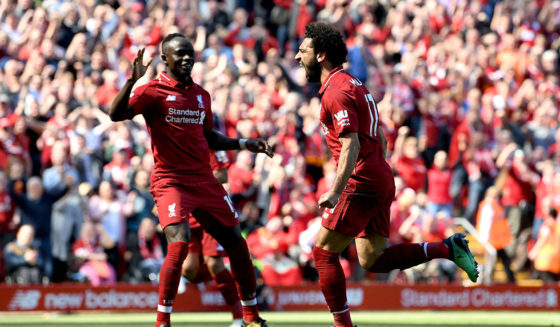 LIVERPOOL, ENGLAND - MAY 13: Mohamed Salah of Liverpool celebrates with Sadio Mane of Liverpool after scoring his sides first goal during the Premier League match between Liverpool and Brighton and Hove Albion at Anfield on May 13, 2018 in Liverpool, England. (Photo by Michael Regan/Getty Images)