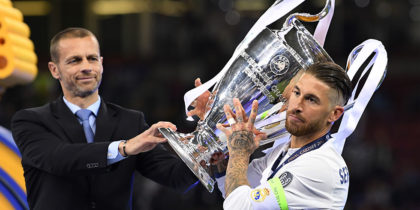 CARDIFF, WALES - JUNE 03: Sergio Ramos of Real Madrid collects the trophy from UEFA President Aleksander Ceferin after the UEFA Champions League Final between Juventus and Real Madrid at National Stadium of Wales on June 3, 2017 in Cardiff, Wales. (Photo by Matthias Hangst/Getty Images)