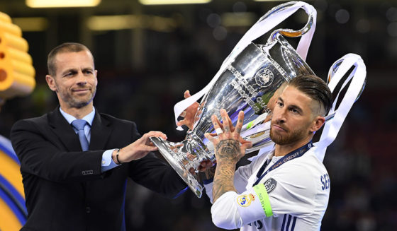 CARDIFF, WALES - JUNE 03: Sergio Ramos of Real Madrid collects the trophy from UEFA President Aleksander Ceferin after the UEFA Champions League Final between Juventus and Real Madrid at National Stadium of Wales on June 3, 2017 in Cardiff, Wales. (Photo by Matthias Hangst/Getty Images)