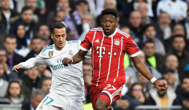 Real Madrid's Spanish midfielder Lucas Vazquez (L) and Bayern Munich's Austrian defender David Alaba vie for the ball during the UEFA Champions League semi-final second-leg football match Real Madrid CF vs FC Bayern Munich in Madrid, Spain, on May 1, 2018. (Photo by GABRIEL BOUYS / AFP) (Photo credit should read GABRIEL BOUYS/AFP/Getty Images)