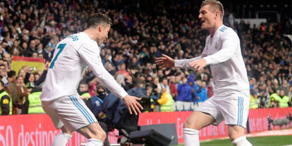 Real Madrid's Portuguese forward Cristiano Ronaldo (L) celebrates a goal with Real Madrid's German midfielder Toni Kroos during the Spanish League football match between Real Madrid CF and Girona FC at the Santiago Bernabeu stadium in Madrid on March 18, 2018. / AFP PHOTO / JAVIER SORIANO (Photo credit should read JAVIER SORIANO/AFP/Getty Images)