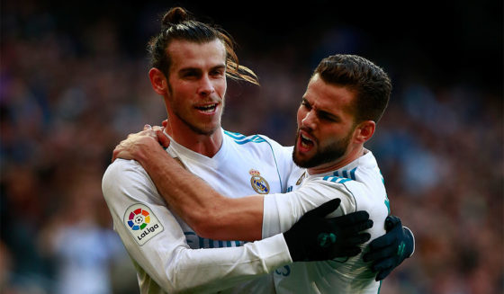 MADRID, SPAIN - JANUARY 21: Gareth Bale (L) of Real Madrid CF celebrates scoring their second goal with teammate Nacho Fernandez (R) during the La Liga match between Real Madrid CF and Deportivo La Coruna at Estadio Santiago Bernabeu on January 21, 2018 in Madrid, Spain. (Photo by Gonzalo Arroyo Moreno/Getty Images)