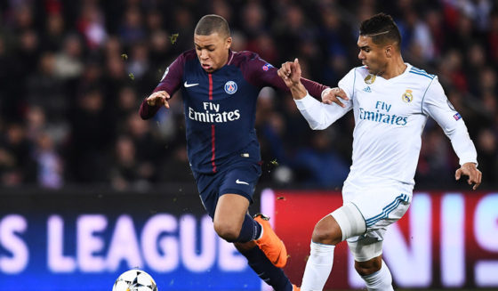 Paris Saint-Germain's French forward Kylian Mbappe (L) vies for the ball with Real Madrid's Brazilian midfielder Casemiro during the UEFA Champions League round of 16 second leg football match between Paris Saint-Germain (PSG) and Real Madrid on March 6, 2018, at the Parc des Princes stadium in Paris. / AFP PHOTO / FRANCK FIFE (Photo credit should read FRANCK FIFE/AFP/Getty Images)