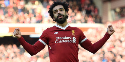 Liverpool's Egyptian midfielder Mohamed Salah celebrates scoring the team's second goal during the English Premier League football match between Liverpool and West Ham United at Anfield in Liverpool, north west England on February 24, 2018. / AFP PHOTO / Oli SCARFF / RESTRICTED TO EDITORIAL USE. No use with unauthorized audio, video, data, fixture lists, club/league logos or 'live' services. Online in-match use limited to 75 images, no video emulation. No use in betting, games or single club/league/player publications. / (Photo credit should read OLI SCARFF/AFP/Getty Images)