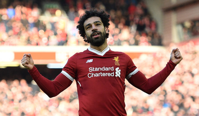 Liverpool's Egyptian midfielder Mohamed Salah celebrates scoring the team's second goal during the English Premier League football match between Liverpool and West Ham United at Anfield in Liverpool, north west England on February 24, 2018. / AFP PHOTO / Oli SCARFF / RESTRICTED TO EDITORIAL USE. No use with unauthorized audio, video, data, fixture lists, club/league logos or 'live' services. Online in-match use limited to 75 images, no video emulation. No use in betting, games or single club/league/player publications. / (Photo credit should read OLI SCARFF/AFP/Getty Images)