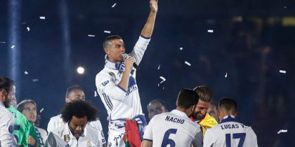 Real Madrid's Portuguese forward Cristiano Ronaldo (C) speaks as he celebrates with teammates the team's win, at the Santiago Bernabeu stadium in Madrid on June 4, 2017 after winning the UEFA Champions League football match final Juventus vs Real Madrid CF held at the National Stadium of Wales in Cardiff on June 3, 2017. / AFP PHOTO / Oscar DEL POZO (Photo credit should read OSCAR DEL POZO/AFP/Getty Images)