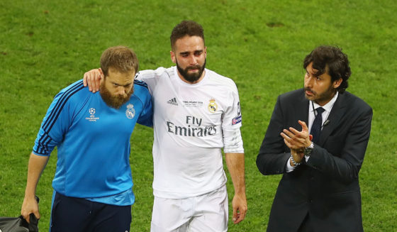MILAN, ITALY - MAY 28: Dani Carvajal of Real Madrid is is lead of the pitch as he substituted after getting injured during the UEFA Champions League Final match between Real Madrid and Club Atletico de Madrid at Stadio Giuseppe Meazza on May 28, 2016 in Milan, Italy. (Photo by Clive Mason/Getty Images)
