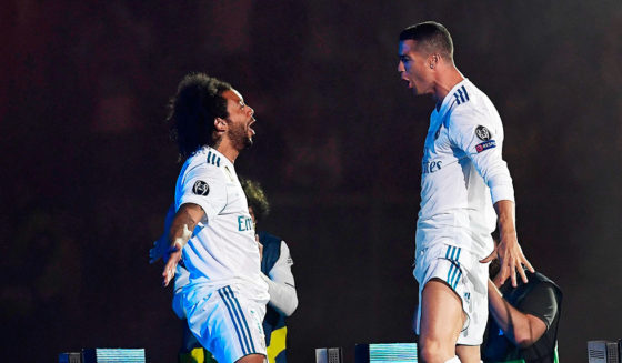 Marcelo, Cristiano Ronaldo Real Madrid's Brazilian defender Marcelo (L) and Real Madrid's Portuguese forward Cristiano Ronaldo celebrate at the Santiago Bernabeu stadium in Madrid on May 27, 2018 during a victory ceremony after Real Madrid won its third Champions League title in a row in Kiev. (Photo by OSCAR DEL POZO / AFP) (Photo credit should read OSCAR DEL POZO/AFP/Getty Images)