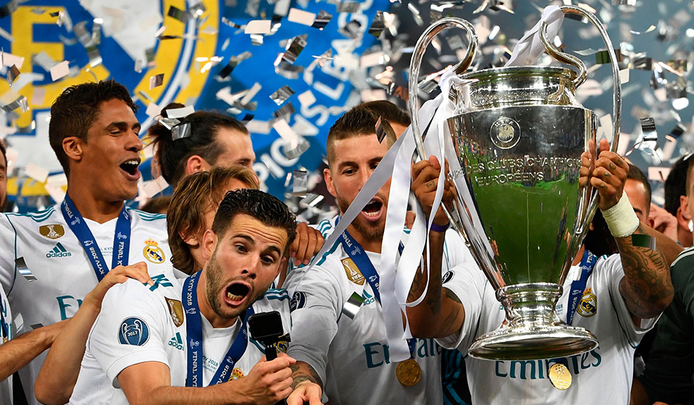 TOPSHOT - Real Madrid's Spanish defender Nacho Fernandez direct the selfie stick as Real Madrid players celebrate winning the UEFA Champions League final football match between Liverpool and Real Madrid at the Olympic Stadium in Kiev, Ukraine on May 26, 2018. - Real Madrid defeated Liverpool 3-1. (Photo by Paul ELLIS / AFP) (Photo credit should read PAUL ELLIS/AFP/Getty Images)