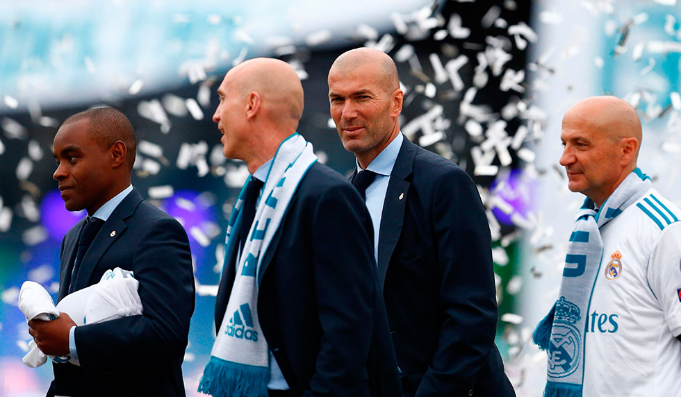 (FromL) Real Madrid's assistant coaches Amidou Msaidie, assistant coach David Bettoni, Real Madrid's French coach Zinedine Zidane, and Antonio Pintus celebrate at Cibeles square in Madrid on May 27, 2018 after Real Madrid won their third Champions League title in a row in Kiev. (Photo by BENJAMIN CREMEL / AFP) (Photo credit should read BENJAMIN CREMEL/AFP/Getty Images)