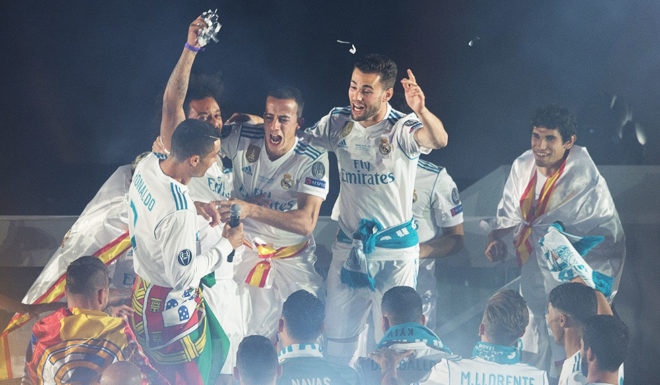 MADRID, SPAIN - MAY 27: Cristiano Ronaldo (left) of Real Madrid celebrates with teammates during celebrations at the Santiago Bernabeu stadium following their victory last night in Kiev in the UEFA Champions League final, on May 27, 2018 in Madrid, Spain. Real beat Liverpool 3-1 in the final to lift the European Cup and Champions League for the 13th time. (Photo by Denis Doyle/Getty Images) (Photo by Denis Doyle/Getty Images)