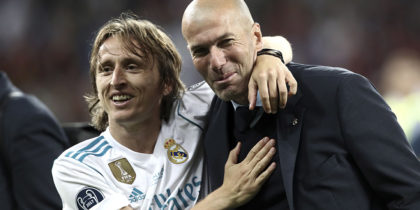 Real Madrid's French coach Zinedine Zidane (R) and Real Madrid's Croatian midfielder Luka Modric celebrate after winning the UEFA Champions League final football match between Liverpool and Real Madrid at the Olympic Stadium in Kiev, Ukraine on May 26, 2018. (Photo by Isabella BONOTTO / Update Images Press / AFP) (Photo credit should read ISABELLA BONOTTO/AFP/Getty Images)