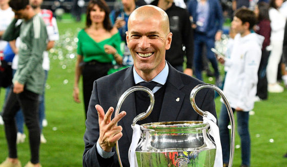 TOPSHOT - Real Madrid's French coach Zinedine Zidane poses with the trophy after winning the UEFA Champions League final football match between Liverpool and Real Madrid at the Olympic Stadium in Kiev, Ukraine, on May 26, 2018. (Photo by GENYA SAVILOV / AFP) (Photo credit should read GENYA SAVILOV/AFP/Getty Images)