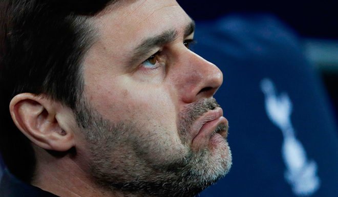 Tottenham Hotspur's Argentinian head coach Mauricio Pochettino takes his seat for the UEFA Champions League round of sixteen second leg football match between Tottenham Hotspur and Juventus at Wembley Stadium in London, on March 7, 2018. / AFP PHOTO / Adrian DENNIS (Photo credit should read ADRIAN DENNIS/AFP/Getty Images)
