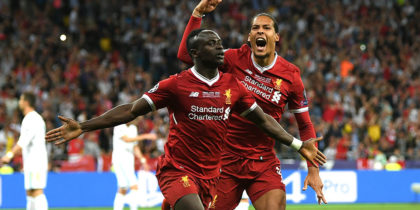 KIEV, UKRAINE - MAY 26: Sadio Mane of Liverpool celebrates after scoring his sides first goal with Virgil van Dijk of Liverpool during the UEFA Champions League Final between Real Madrid and Liverpool at NSC Olimpiyskiy Stadium on May 26, 2018 in Kiev, Ukraine. (Photo by Shaun Botterill/Getty Images)
