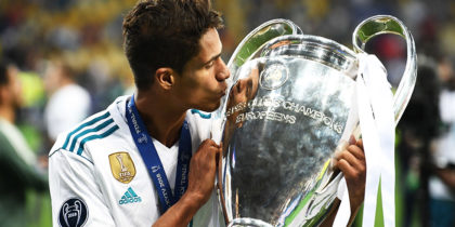 TOPSHOT - Real Madrid's French defender Raphael Varane kisses the trophy as he poses after winning the UEFA Champions League final football match between Liverpool and Real Madrid at the Olympic Stadium in Kiev, Ukraine, on May 26, 2018. (Photo by FRANCK FIFE / AFP) (Photo credit should read FRANCK FIFE/AFP/Getty Images)