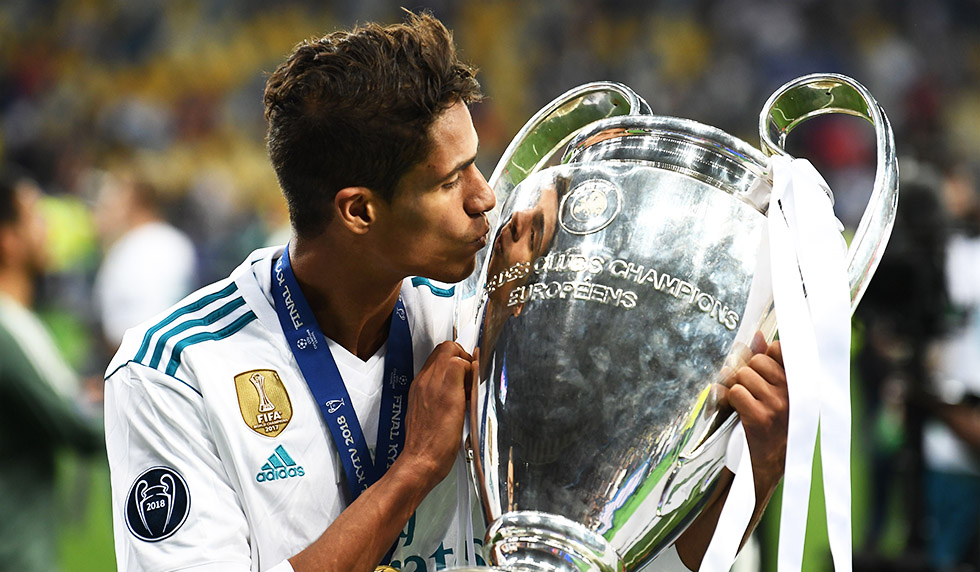 TOPSHOT - Real Madrid's French defender Raphael Varane kisses the trophy as he poses after winning the UEFA Champions League final football match between Liverpool and Real Madrid at the Olympic Stadium in Kiev, Ukraine, on May 26, 2018. (Photo by FRANCK FIFE / AFP) (Photo credit should read FRANCK FIFE/AFP/Getty Images)