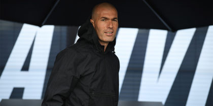 Former French football player and former Real Madrid coach Zinedine Zidane looks on as he shelters under an umbrella in Saint Denis, suburban Paris on June 11, 2018 during an event marking the 20th anniversary of France's 1998 World Cup victory. (Photo by Eric FEFERBERG / AFP) (Photo credit should read ERIC FEFERBERG/AFP/Getty Images)