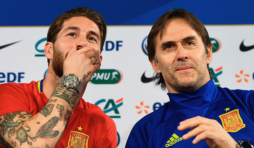 (From L) Spain's defender Sergio Ramos jokes with Spain's head coach Julen Lopetegui during a press conference at the Stade de France stadium in Saint-Denis, north of Paris, on March 27, 2017 on the eve of the friendly football match Spain against France. / AFP PHOTO / FRANCK FIFE (Photo credit should read FRANCK FIFE/AFP/Getty Images)