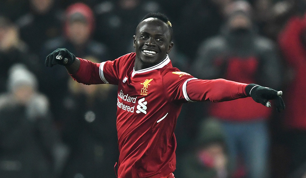 LIVERPOOL, ENGLAND - MARCH 03: Sadio Mane of Liverpool celebrates after scoring his sides second goal during the Premier League match between Liverpool and Newcastle United at Anfield on March 3, 2018 in Liverpool, England. (Photo by Gareth Copley/Getty Images)