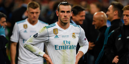 Real Madrid's Welsh forward Gareth Bale waits to collect his winner's medal on the pitch as Real Madrid players celebrate winning the UEFA Champions League final football match between Liverpool and Real Madrid at the Olympic Stadium in Kiev, Ukraine on May 26, 2018. - Real Madrid defeated Liverpool 3-1. (Photo by Paul ELLIS / AFP) (Photo credit should read PAUL ELLIS/AFP/Getty Images)