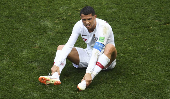 Portugal's forward Cristiano Ronaldo (R) reacts following a challenge during the Russia 2018 World Cup Group B football match between Portugal and Morocco at the Luzhniki Stadium in Moscow on June 20, 2018. (Photo by Patrik STOLLARZ / AFP) / RESTRICTED TO EDITORIAL USE - NO MOBILE PUSH ALERTS/DOWNLOADS (Photo credit should read PATRIK STOLLARZ/AFP/Getty Images)