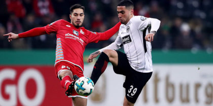 FRANKFURT AM MAIN, GERMANY - FEBRUARY 07: Omar Mascarell (R) of Frankfurt and Suat Serder of Mainz battle for the ball during the DFB Cup quarter final match between Eintracht Frankfurt and 1. FSV Mainz 05 at Commerzbank-Arena on February 7, 2018 in Frankfurt am Main, Germany. (Photo by Alex Grimm/Bongarts/Getty Images)