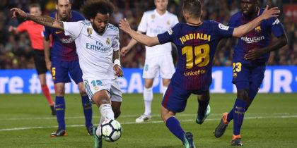 Barcelona's Spanish defender Jordi Alba (R) vies with Real Madrid's Brazilian defender Marcelo during the Spanish league football match between FC Barcelona and Real Madrid CF at the Camp Nou stadium in Barcelona on May 6, 2018. (Photo by Josep LAGO / AFP) (Photo credit should read JOSEP LAGO/AFP/Getty Images)