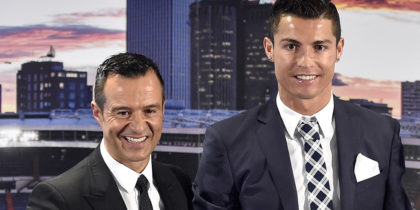Real Madrid's forward Portuguese Cristiano Ronaldo (2nd L) poses with his agent Jorge Mendes (L), his son Cristiano Jr and his mother Maria Dolores dos Santos Aveiro (R) during a ceremony for becoming Real Madrid's all-time leading scorer at the Santiago Bernabeu stadium in Madrid on October 2, 2015. Cristiano Ronaldo surpassed 500 career goals and tied Raul as Real Madrid's all-time leading scorer with a double in the Spanish giants 2-0 win away at Malmo on September 30, 2015. AFP PHOTO / GERARD JULIEN (Photo credit should read GERARD JULIEN/AFP/Getty Images)