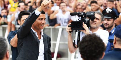 Portuguese footballer Cristiano Ronaldo waves to supporters as he arrives on July 16, 2018 at the Juventus medical centre at the Alliance stadium in Turin. - A Turin hit by Cristiano Ronaldo fever awaits the striker as Juventus prepare to unveil the surprise signing, that after the end of the World Cup, puts all eyes on the Italian champions and Serie A. (Photo by Miguel MEDINA / AFP) (Photo credit should read MIGUEL MEDINA/AFP/Getty Images)