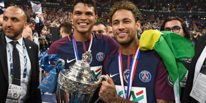 TOPSHOT - Paris Saint-Germain's Brazilian forwar Neymar Jr (R) and Paris Saint-Germain's Brazilian defender Thiago Silva (C) celebrate with the trophy at the end of the French Cup final football match between Les Herbiers and Paris Saint-Germain (PSG), on May 8, 2018 at the Stade de France in Saint-Denis, outside Paris. (Photo by FRANCK FIFE / AFP) (Photo credit should read FRANCK FIFE/AFP/Getty Images)