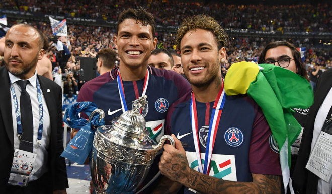 TOPSHOT - Paris Saint-Germain's Brazilian forwar Neymar Jr (R) and Paris Saint-Germain's Brazilian defender Thiago Silva (C) celebrate with the trophy at the end of the French Cup final football match between Les Herbiers and Paris Saint-Germain (PSG), on May 8, 2018 at the Stade de France in Saint-Denis, outside Paris. (Photo by FRANCK FIFE / AFP) (Photo credit should read FRANCK FIFE/AFP/Getty Images)