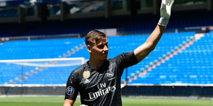 Real Madrid's new Ukrainian goalkeeper Andriy Lunin waves as he arrives to pose on the pitch during his official presentation at the Santiago Bernabeu Stadium in Madrid on July 23, 2018. (Photo by JAVIER SORIANO / AFP) (Photo credit should read JAVIER SORIANO/AFP/Getty Images)