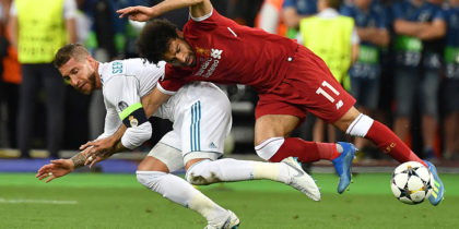 TOPSHOT - Liverpool's Egyptian forward Mohamed Salah (R) falls with Real Madrid's Spanish defender Sergio Ramos leading to Salah being injured during the UEFA Champions League final football match between Liverpool and Real Madrid at the Olympic Stadium in Kiev, Ukraine, on May 26, 2018. (Photo by GENYA SAVILOV / AFP) (Photo credit should read GENYA SAVILOV/AFP/Getty Images)