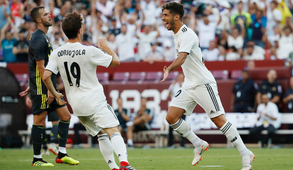 LANDOVER, MD - AUGUST 04: Marco Asensio #20 of Real Madrid celebrates after scoring a goal against Juventus in the second half during the International Champions Cup 2018 at FedExField on August 4, 2018 in Landover, Maryland. (Photo by Patrick McDermott/Getty Images)