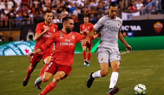 EAST RUTHERFORD, NJ - AUGUST 7: Javier Pastore #27 of Roma fights for the ball with Daniel Carvajal #2 of Real Madrid during their match at MetLife Stadium on August 7, 2018 in East Rutherford, New Jersey. (Photo by Jeff Zelevansky/Getty Images)