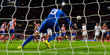 LISBON, PORTUGAL - MAY 24: Thibaut Courtois of Club Atletico de Madrid fails to stop Sergio Ramos of Real Madrid scoring their first goal during the UEFA Champions League Final between Real Madrid and Atletico de Madrid at Estadio da Luz on May 24, 2014 in Lisbon, Portugal. (Photo by Shaun Botterill/Getty Images)
