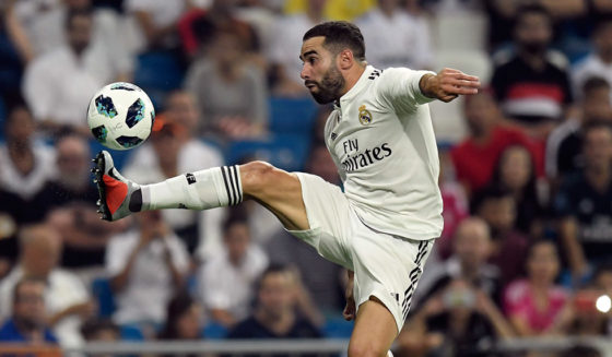 Real Madrid's Spanish defender Dani Carvajal controls the ball during the Santiago Bernabeu Trophy football match between Real Madrid and AC Milan in Madrid on August 11, 2018. (Photo by GABRIEL BOUYS / AFP) (Photo credit should read GABRIEL BOUYS/AFP/Getty Images)