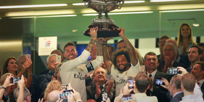 MADRID, SPAIN - AUGUST 11: Captain of Real Madrid Sergio Ramos (L) and his teammate Marcelo (R) stand the Santiago Bernabéu Trophy ahead their president Florentino Perez (2ndL) after winning the friendly match between Real Madrid CF and AC Milan at Estadio Santiago Bernabeu on August 11, 2018 in Madrid, Spain. (Photo by Gonzalo Arroyo Moreno/Getty Images)