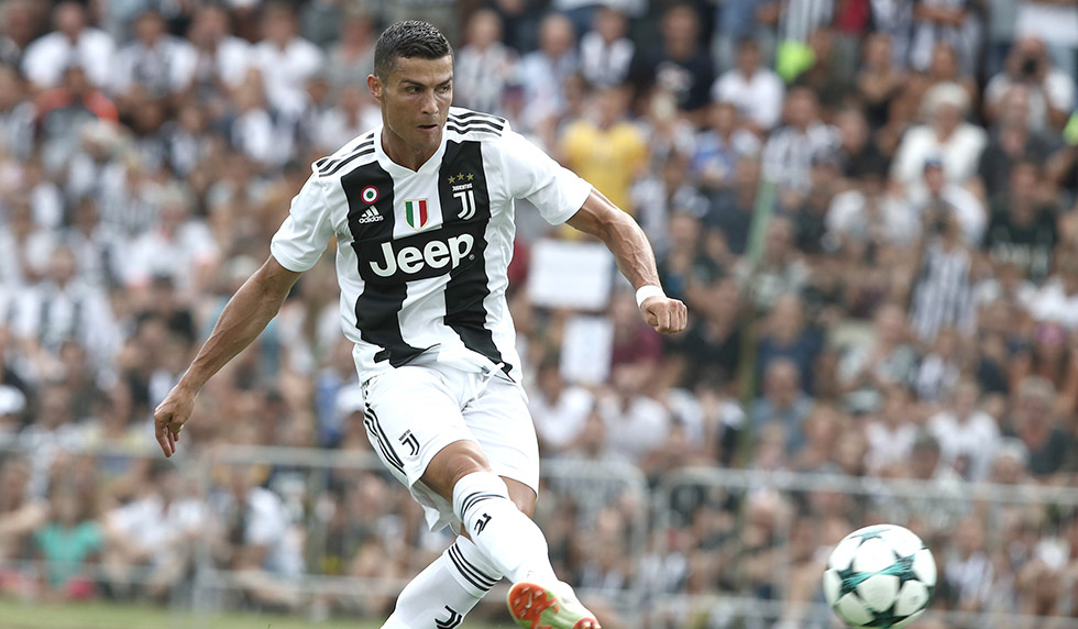 Juventus' forward from Portugal Cristiano Ronaldo scores a goal during the friendly football match between Juventus A and Juventus B at Villar Perosa, on August 12, 2018 at Villar Perosa. (Photo by Isabella Bonotto / AFP) (Photo credit should read ISABELLA BONOTTO/AFP/Getty Images)