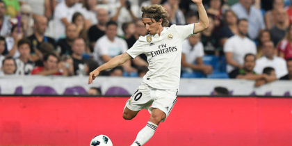 Real Madrid's Croatian midfielder Luka Modric prepares to kick the ball during the Santiago Bernabeu Trophy football match between Real Madrid and AC Milan in Madrid on August 11, 2018. (Photo by GABRIEL BOUYS / AFP) (Photo credit should read GABRIEL BOUYS/AFP/Getty Images)