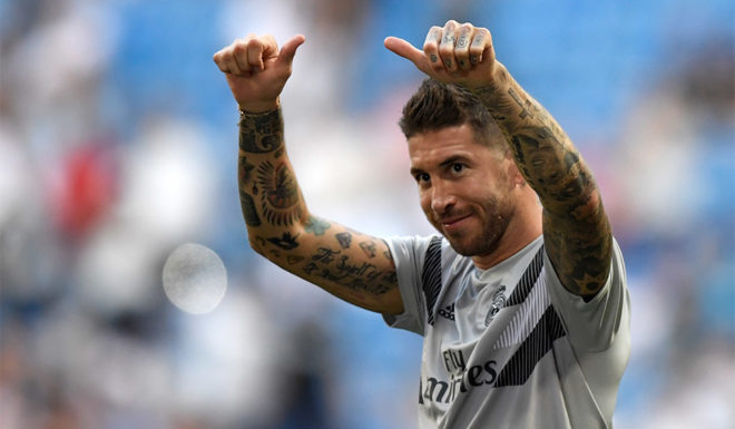Real Madrid's Spanish defender Sergio Ramos salutes fans before the Santiago Bernabeu Trophy football match between Real Madrid and AC Milan in Madrid on August 11, 2018. (Photo by GABRIEL BOUYS / AFP) (Photo credit should read GABRIEL BOUYS/AFP/Getty Images)