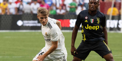Real Madrid's Martin Odegaard (L) controls the ball in front of Juventus' Leandro Fernandes during the International Champions Cup (ICC) friendly football match between Real Madrid and Juventus at Fedex Field in Landover, Maryland, on August 4, 2018. (Photo by NICHOLAS KAMM / AFP) (Photo credit should read NICHOLAS KAMM/AFP/Getty Images)
