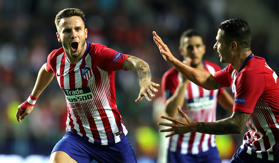 TALLINN, ESTONIA - AUGUST 15: Saul Niguez of Atletico Madrid celebrates with teammates after scoring his sides third goal during the UEFA Super Cup between Real Madrid and Atletico Madrid at Lillekula Stadium on August 15, 2018 in Tallinn, Estonia. (Photo by Alexander Hassenstein/Getty Images)