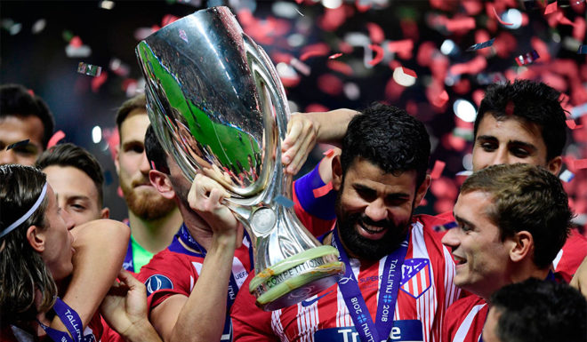 Atletico Madrid's Spanish forward Diego Costa (C) holds the trophy as he celebrates with teammates at the end of the UEFA Super Cup football match between Real Madrid and Atletico Madrid at the Lillekula Stadium in the Estonian capital Tallinn on August 15, 2018. (Photo by JAVIER SORIANO / AFP) (Photo credit should read JAVIER SORIANO/AFP/Getty Images)