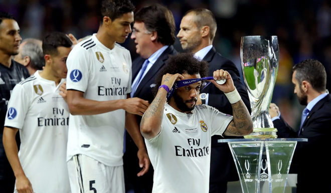 TALLINN, ESTONIA - AUGUST 15: Marcelo of Real Madrid looks dejected as he walks past the trophy following the UEFA Super Cup between Real Madrid and Atletico Madrid at Lillekula Stadium on August 15, 2018 in Tallinn, Estonia. (Photo by Alexander Hassenstein/Getty Images)
