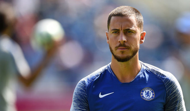 Chelsea's Belgian midfielder Eden Hazard warms up before the English Premier League football match between Huddersfield Town and Chelsea at the John Smith's stadium in Huddersfield, northern England on August 11, 2018. (Photo by Oli SCARFF / AFP) / RESTRICTED TO EDITORIAL USE.No use with unauthorized audio, video, data, fixture lists, club/league logos or 'live' services. Online in-match use limited to 120 images. An additional 40 images may be used in extra time. No video emulation. Social media in-match use limited to 120 images. An additional 40 images may be used in extra time. No use in betting publications, games or single club/league/player publications/ / (Photo credit should read OLI SCARFF/AFP/Getty Images)