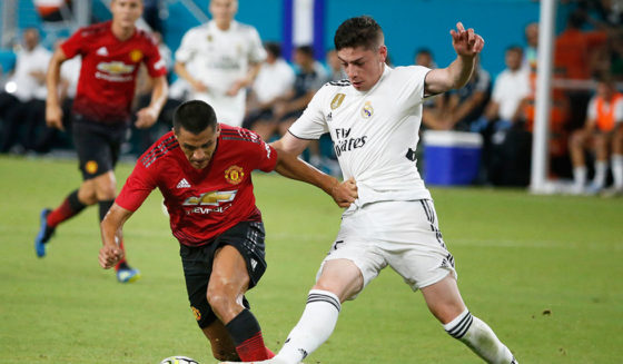 Manchester United's Chilean foward Alexis Sanchez (L) vies for the ball with Real Madrid's Uruguayan midfielder Federico Valverde (R) during their International Champions Cup friendly football match at Hard Rock Stadium in Miami, Florida, on July 31, 2018. (Photo by RHONA WISE / AFP) (Photo credit should read RHONA WISE/AFP/Getty Images)