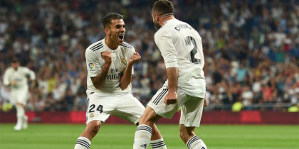 MADRID, SPAIN - AUGUST 19: Dani Carvajal of Real Madrid celebrates with teammate Daniel Ceballos of Real Madrid after scoring his teams opening goal during the La Liga match between Real Madrid CF and Getafe CF at Estadio Santiago Bernabeu on August 19, 2018 in Madrid, Spain. (Photo by Denis Doyle/Getty Images)